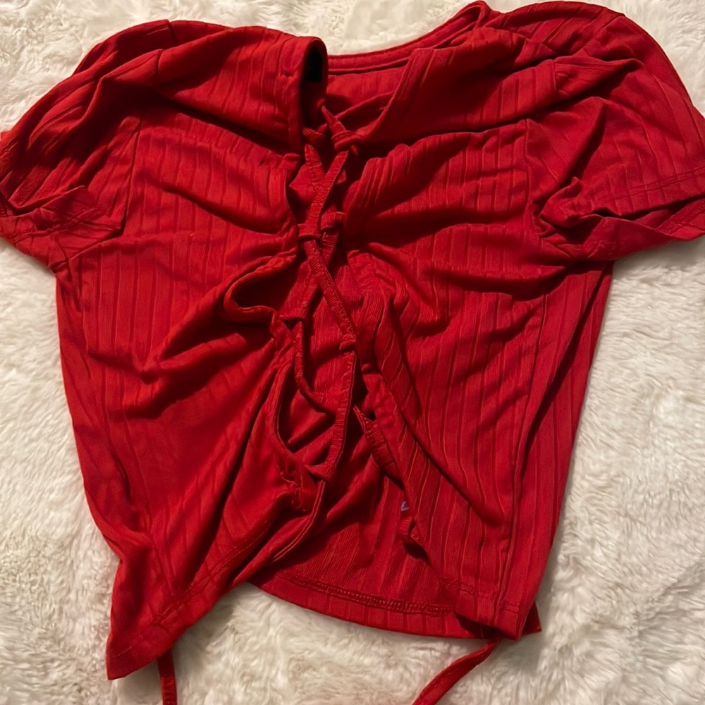 Red crop top with a open back that ties at the bottom